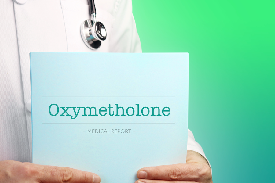 Doctor holding medical report about the risks and side effects of Anadrol (Oxymetholone)